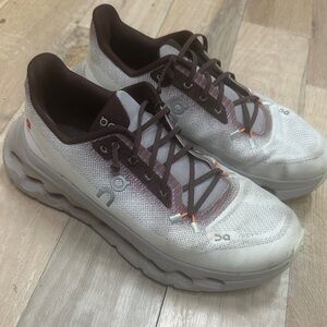 On Running Cream and Brown Athletic Shoes